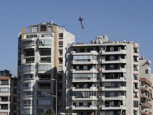 A missile launched from an Israeli jet heads towards a building in Ghobeiri, Beirut. Picture: AP Photo/Bilal Hussein