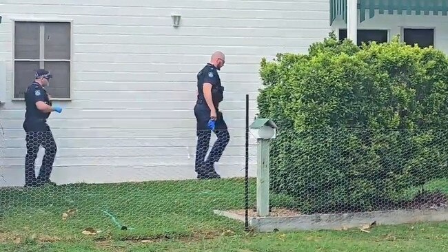 Police at the scene where a silver Mercedes was stolen by a woman armed with a hammer outside a home on Eleventh St, Railway Estate about 8.20am on Thursday. Picture: Natasha Emeck