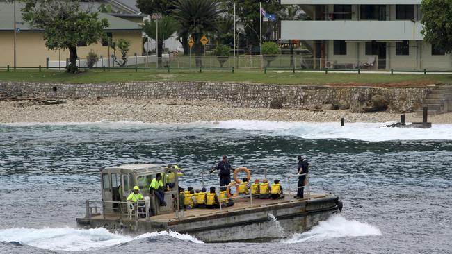 An image taken in 2013 of Vietnamese asylum seekers being taken by barge to a jetty on Australia’s Christmas Island. Scott Morrison flagged the possibility of reopening the disused detention camp in anticipation of a new wave of asylum seekers. Picture: AP 