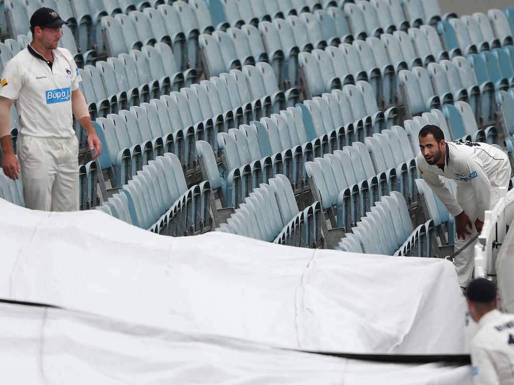 A Steve Smith six is retrieved from empty stands by John Hastings and Fawad Ahmed back in 2013. Picture: Michael Dodge/Getty Images