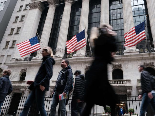 NEW YORK, NEW YORK - MAY 02: People walk along Wall Street near the New York Stock Exchange (NYSE) on May 02, 2022 in New York City. After falling over 600 points on Friday, stocks were up slightly in morning trading.   Spencer Platt/Getty Images/AFP == FOR NEWSPAPERS, INTERNET, TELCOS & TELEVISION USE ONLY ==