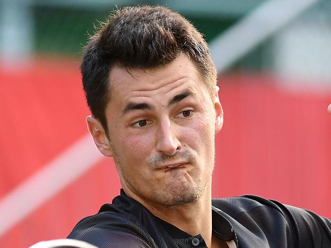 TOKYO, JAPAN - OCTOBER 04:  Bernard Tomic of Australia plays a forehand against Diego Schwartzman of Argentina during day three of the Rakuten Open at Ariake Coliseum on October 4, 2017 in Tokyo, Japan.  (Photo by Atsushi Tomura/Getty Images)