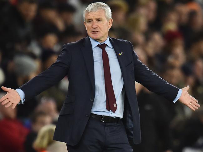 Southampton Welsh manager Mark Hughes reacts on the touchline during the English Premier League football match between Southampton and Manchester United at St Mary's Stadium in Southampton, southern England on December 1, 2018. (Photo by Glyn KIRK / AFP) / RESTRICTED TO EDITORIAL USE. No use with unauthorized audio, video, data, fixture lists, club/league logos or 'live' services. Online in-match use limited to 120 images. An additional 40 images may be used in extra time. No video emulation. Social media in-match use limited to 120 images. An additional 40 images may be used in extra time. No use in betting publications, games or single club/league/player publications. /