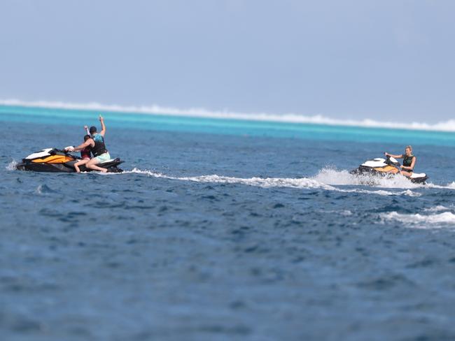 Karl rides ahead of Jasmine in the beautiful waters of Bora Bora. Picture: BackGrid