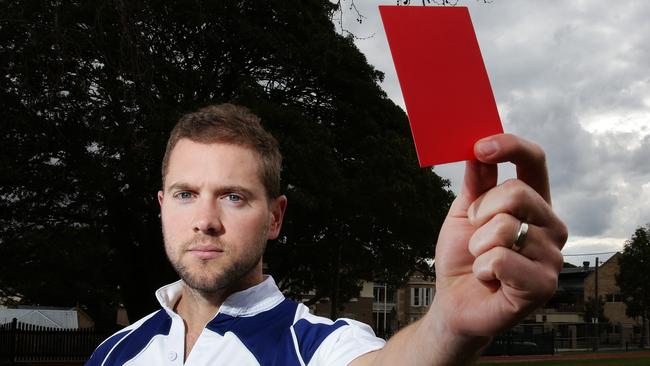 Australian referee Angus Gardner dishes out a red card.