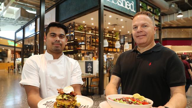 Chef Ashik Rahman and business Owner, Louis Gjorsevski pose for a photo at The Shed Cafe at Macarthur Square today, October 19, 2018. The cafe makes food to order and is a popular destination for locals. (AAP Image/David Swift)