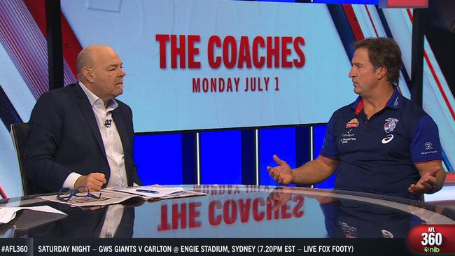 Mark Robinson and Luke Beveridge engaged in a tense debate.