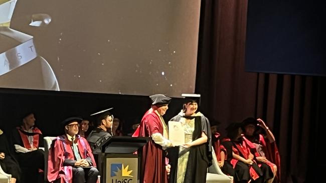 Graduates from the University of the Sunshine Coast's Fraser Coast campus celebrating at the Brolga Theatre.