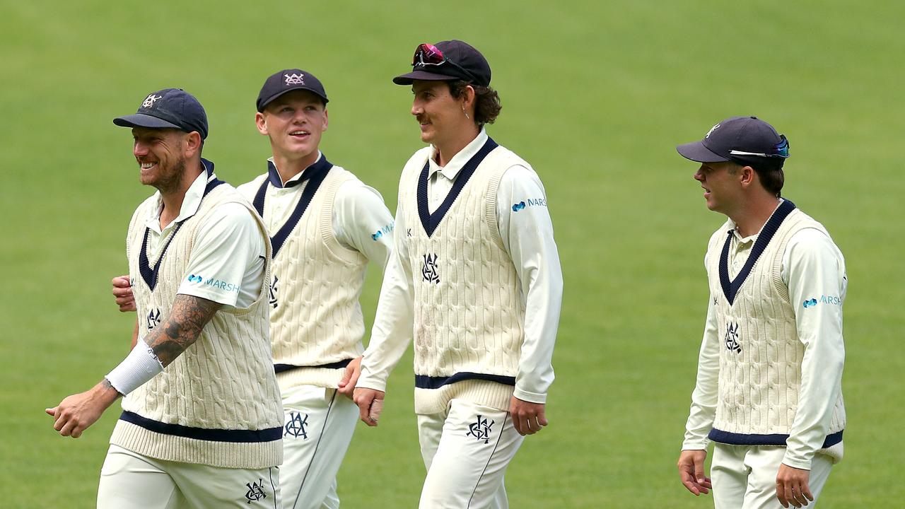 James Pattinson (left) and his Victorian teammates celebrate at the MCG. Picture: Kelly Defina/Getty Images