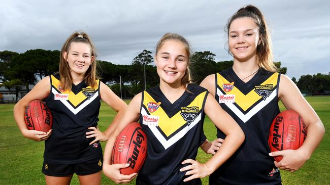 Brighton Bombers female footballers Sarah Rea, Emma Moase and Bella Bailey. Picture: AAP/Mark Brake