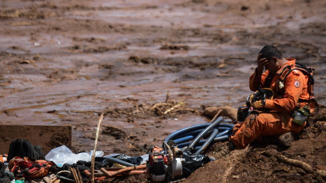 A rescuer takes a break during his work in the search for victims, four days after the collapse of a dam at an iron-ore mine belonging to Brazil's giant mining company Vale near the town of Brumadinho. Picture: AFP