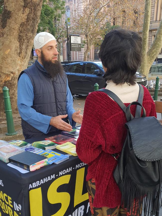 Pictures taken from the Dawah Van's social-media platforms, showing Mr Ousayd (back, centre) preaching around Sydney's Town Hall.