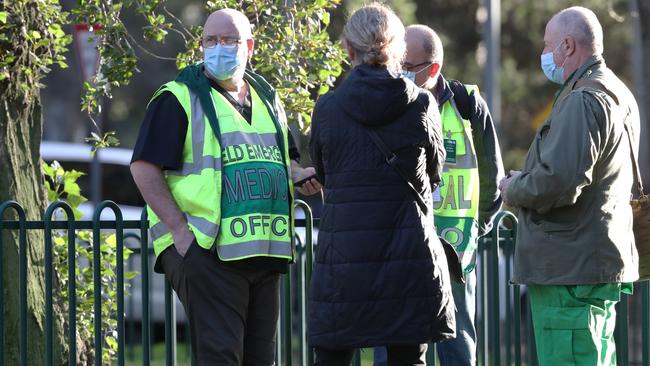 Medical staff at government housing towers on Racecourse road in Flemington which have been locked down by the Victorian Government in an attempt to stop the outbreak of COVID-19. Picture: David Crosling