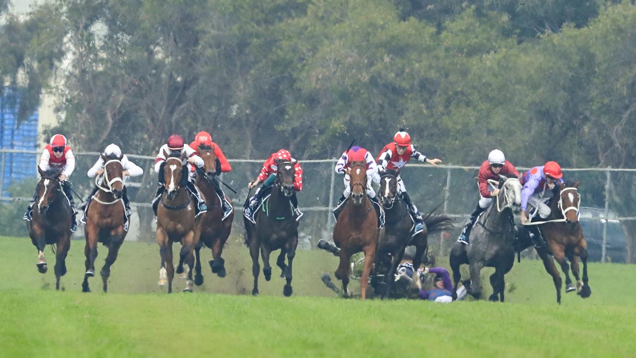 Andrew Adkins on Hot N' Hazy is seen falling during Saturday’s race at Rosehill.