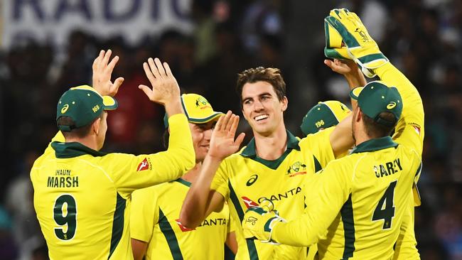 Australian cricketer Pat Cummins (C) celebrates with teammates after taking the wicket of Indian cricketer Ambati Rayudu. Picture: Dibyangshu Sarkar/AFP