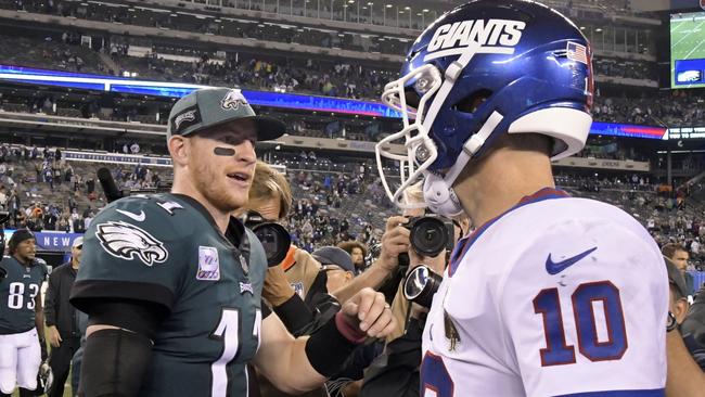 Philadelphia Eagles quarterback Carson Wentz (11) shakes hands with New York Giants quarterback Eli Manning (10) after the game. Picture: AP Photo