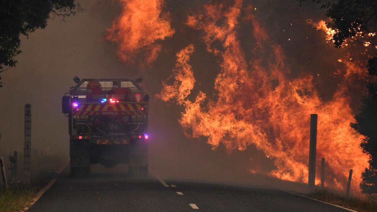 A fire truck is seen near a bushfire in Nana Glen, near Coffs Harbour, Tuesday, November 12, 2019. Picture: Dan Peled/AAP