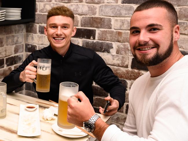 A group of men drinking beer at 'Soy Restaurant' in Bondi Beach, Sydney, Friday, May 15, 2020. Pubs, clubs, cafes, restaurants, and places of worship are now able to welcome up to 10 people inside their doors under an easing of NSW's COVID-19 restrictions. (AAP Image/James Gourley) NO ARCHIVING