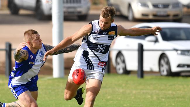 Noarlunga player Jarrad Liebelt (right) suffered a suspected neck injury in the Shoes’ Southern Football League match against Flagstaff Hill on Saturday. Picture: AAP/ Keryn Stevens