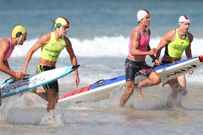 Competitors in the mens open board rescue event. Tasmanian Surf Lifesaving Championships at Clifton Beach. Picture: NIKKI DAVIS-JONES