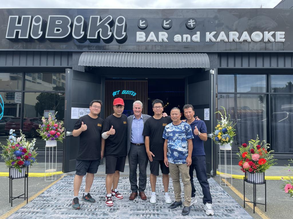 Business partners Leon Di, Bing Guo, John Wang, David Wang, Zhe Lu, and Jing-liang Liang with Mackay mayor Greg Williamson at Hibiki Karaoke and Whiskey Bar opening on February 17, 2023. Photo: Zoe Devenport