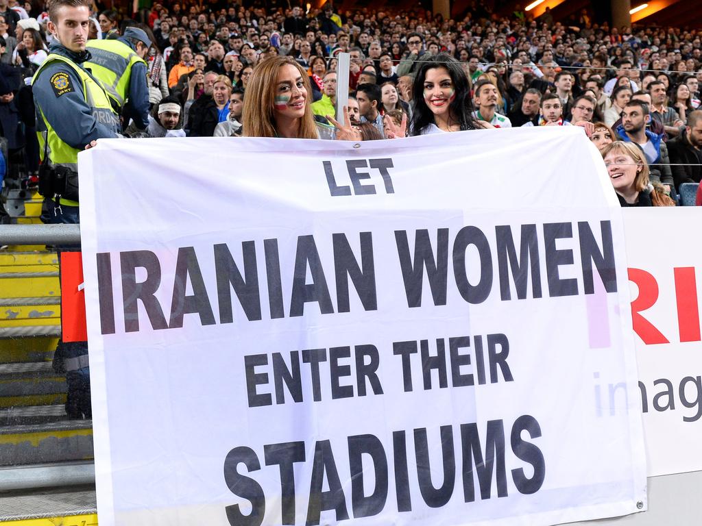 Supporters hold a banner reading 'Let Iranian women enter their stadiums' during the friendly international football match between Sweden and Iran near Stockholm. Picture: AFP