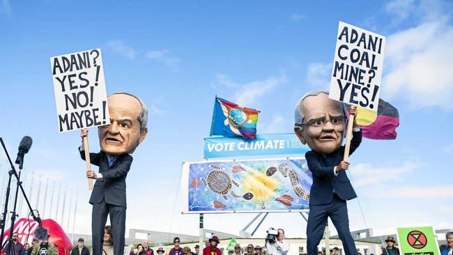 Protestors dressed as Scott Morrison and Bill Shorten during the anti-Adani Rally outside Parliament House in Canberra. Picture: ROHAN THOMSON