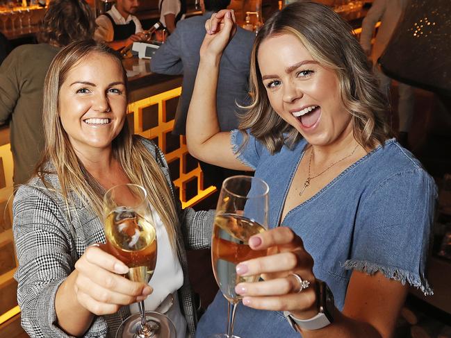 Friends Sarah French of New Town and Emily Atkins of Geilston Bay enjoy standing up having a drink and a dance at The Den along Salamanca. Picture: Zak Simmonds