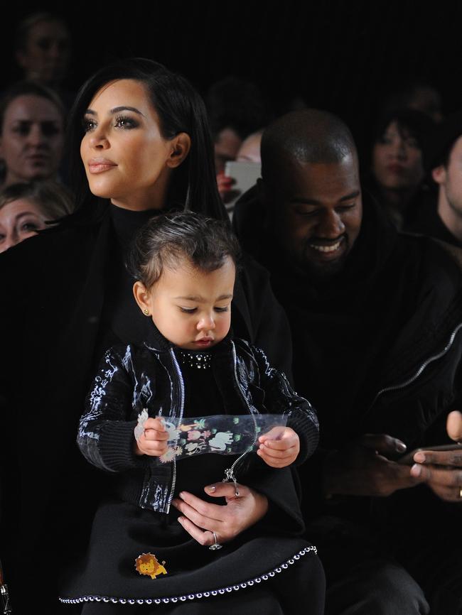 Kim with North and Kanye at the Alexander Wang Fashion Show. Picture: Getty