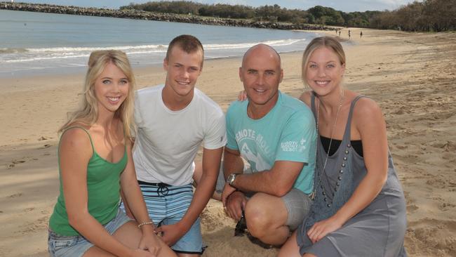 Grant Kenny with his children Jett, Morgan and Jaimi on Mooloolaba Beach. Picture: John McCutcheon