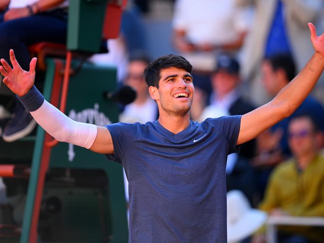 PARIS, FRANCE - JUNE 07: Carlos Alcaraz of Spain celebrates victory against Jannik Sinner of Italy during the Men's Singles Semi-Final match on Day Thirteen of the 2024 French Open at Roland Garros on June 07, 2024 in Paris, France. (Photo by Tim Goode/Getty Images)