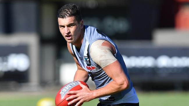 Unless you’re flush with trades, hold on to players such as Tom Rockliff for at least another week. Picture: AAP Image/David Mariuz.