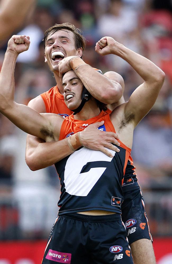 Darcy Jones celebrates kicking a goal with Aaron Cadman. Picture: Phil Hillyard.