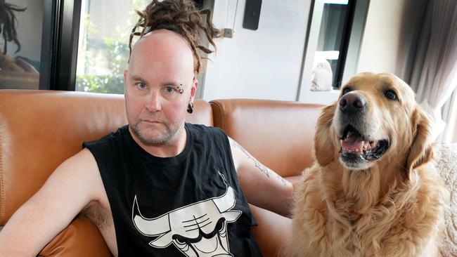 Eli Murn was out to celebrate getting into university, when he lost control of his car and smashed into two trees in the Adelaide Hills. Pictured at home in Mt. Barker with his dog Henry. 30 October 2024. Picture: Dean Martin