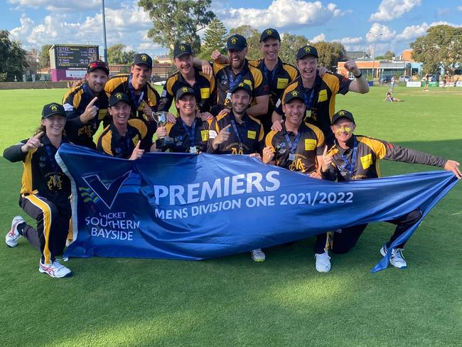 Mentone players show off their CSB Division 1 2021-22 premiership flag.