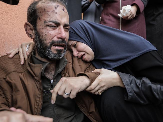 People mourn as they collect the bodies of Palestinians killed in air strikes in Khan Yunis, Gaza. Picture: Getty Images