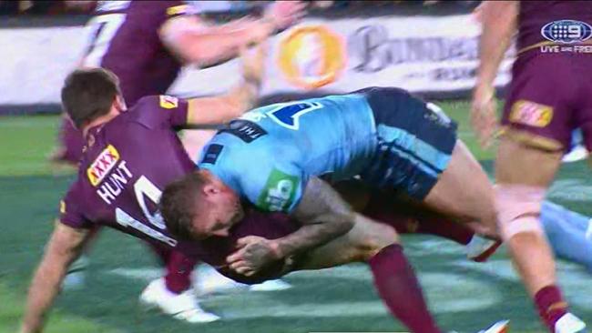 Tariq Sims tackles Ben Hunt off the ball.