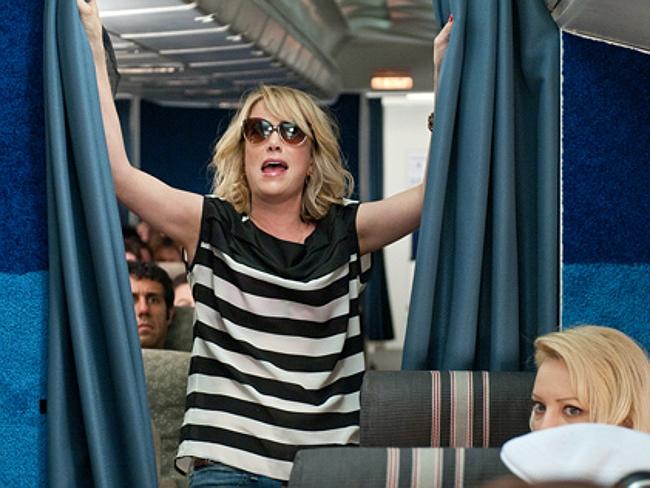 Watch what you drink on a flight or you could end up like this. Picture: Bridesmaids