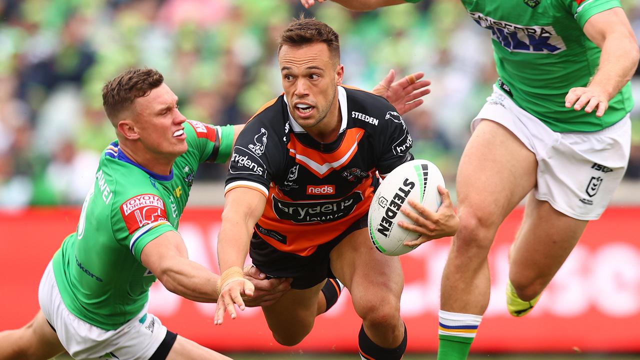 CANBERRA, AUSTRALIA - MARCH 14: Luke Brooks of the Tigers looks to pas during the round one NRL match between the Canberra Raiders and the Wests Tigers at GIO Stadium, on March 14, 2021, in Canberra, Australia. (Photo by Mark Nolan/Getty Images)