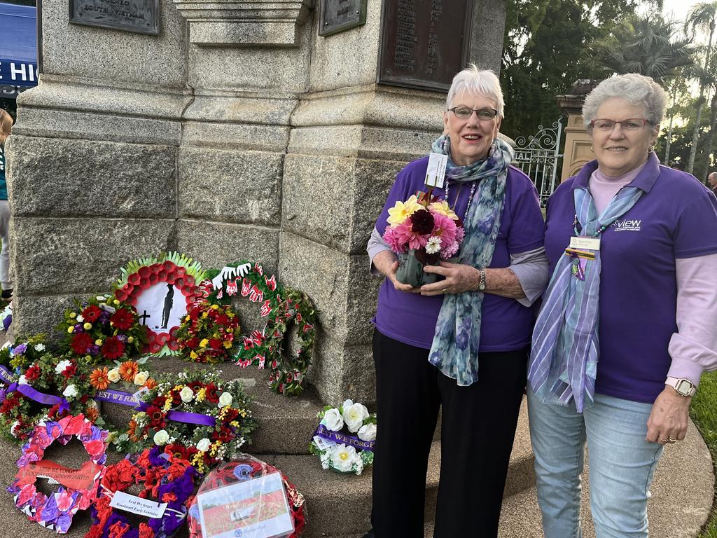 Ann Morris and Dawn Potter from Maryborough View Club laying flowers at the cenotaph.