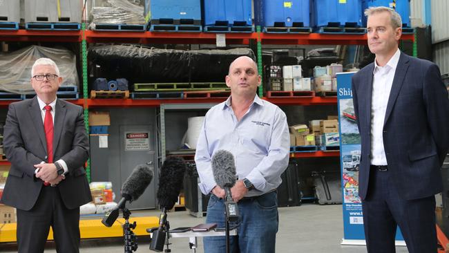 TT-Line's Managing Director Bernard Dwyer, Richard Fader from Tasmanian Shipping Supplies and Transport and Infrastructure Minister Michael Ferguson speak to the media at Tasmanian Shipping Supplies in Hobart on Wednesday, March 22, 2023.