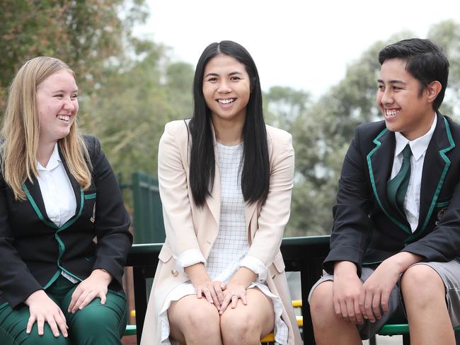 Hoxton Park High School students Danni McQuaggin (left) and Braxton Rokotuku (right) with school careers adviser Kathy Ly. Picture: Richard Dobson