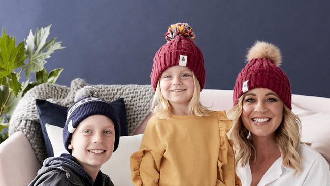 Carrie Bickmore with son Ollie and daughter Evie don beanies to aid the fight against brain cancer.