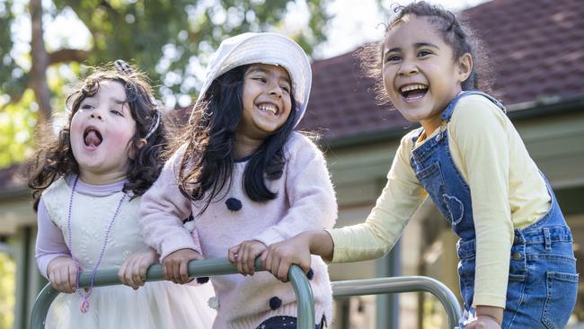 Safiya Tlais, 5, Enayaa Mahmud, 5, and Leilani Lutui, 5, enjoying themselves at Bankstown’s Uniting Dove Cottage Early Learning. Picture: Matthew Vasilescu