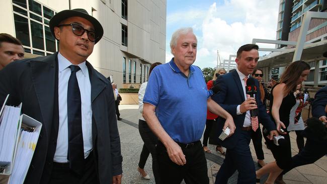 Embattled businessman Clive Palmer leaves the Federal Court with his barrister Andrew Boe (left) after giving evidence at the public examination of the collapse of Queensland Nickel. Photo: Claudia Baxter