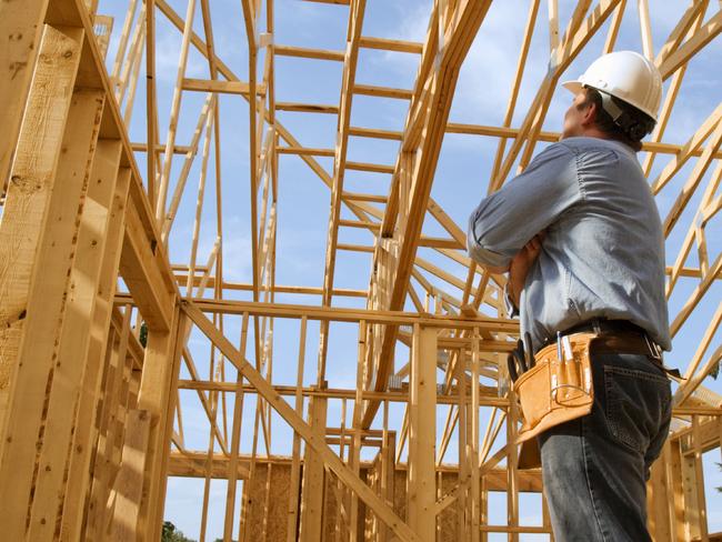 generic pic of builder inside new house under construction