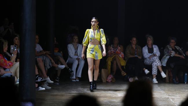 A model showcases the Guyu, Lemon and Rice collection from designers Simone Arnol and Holly McInnes at the Cairns Indigenous Art Fair fashion performance, Woven, held at the Tanks Arts Centre, Edge Hill. Picture: Brendan Radke