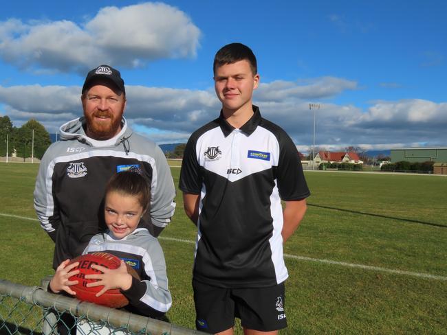 Scottsdale player and former senior coach Joel Hayes with daughter and under-11s player Mila and young player Lochie Bowerman last year. Picture: Jon Tuxworth
