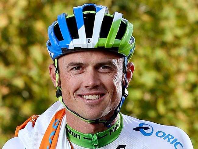 16/01/16 Simon Gerrans with his 3 ochre guernseys in the Tour Down Under Village ahead of the start of the tour tomorrow. photo Calum Robertson