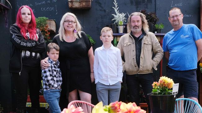 Local mum Bec Provis has autism and adhd, and she has five kids that all have special needs/mental health issues. She has founded a service for people with disability called AmAble in Belmont. Pictured is left Danni, Jack 8, Bec Provis, William 10, their artist employee Pat Brady and husband Hew Provis Picture: Mark Wilson